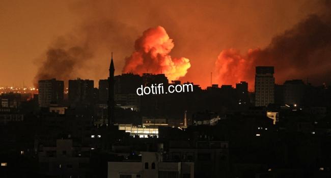 A ball of fire erupts in Gaza City after an Israeli air strike on October 12, 2023. Israel has vowed to "crush" Hamas after gunmen from the Palestinian Islamist group stormed across the border and killed 1,200 people -- the deadliest attack on the country since it was founded 75 years ago.
