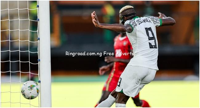 Nigeria's forward #9 Victor Osimhen (C) scores a goal which was later disallowed after a VAR review during the Africa Cup of Nations (CAN) 2024 group A football match between Guinea-Bissau and Nigeria at the Felix Houphouet-Boigny Stadium in Abidjan on January 22, 2024.